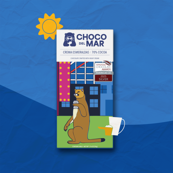 Crema Esmeraldas Front Packaging with artwork of a mountain lion holding a cup of heavy cream Stylized with a sun and a pitcher, and measuring cup, of cream.